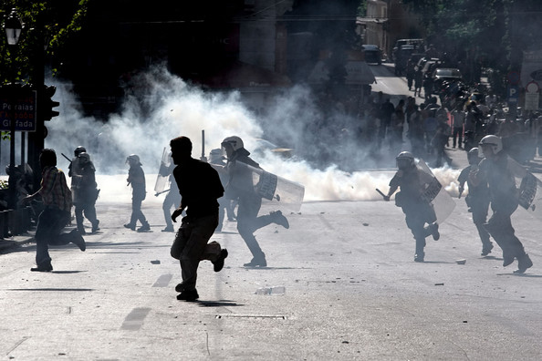 Riot police take action during clashes with Muslim immigrants on May 22, 2009 in Athens, Greece. According to reports the clashes were sparked after police, running checks at a Syrian-owned coffee shop, took a man's Koran and tore it up.